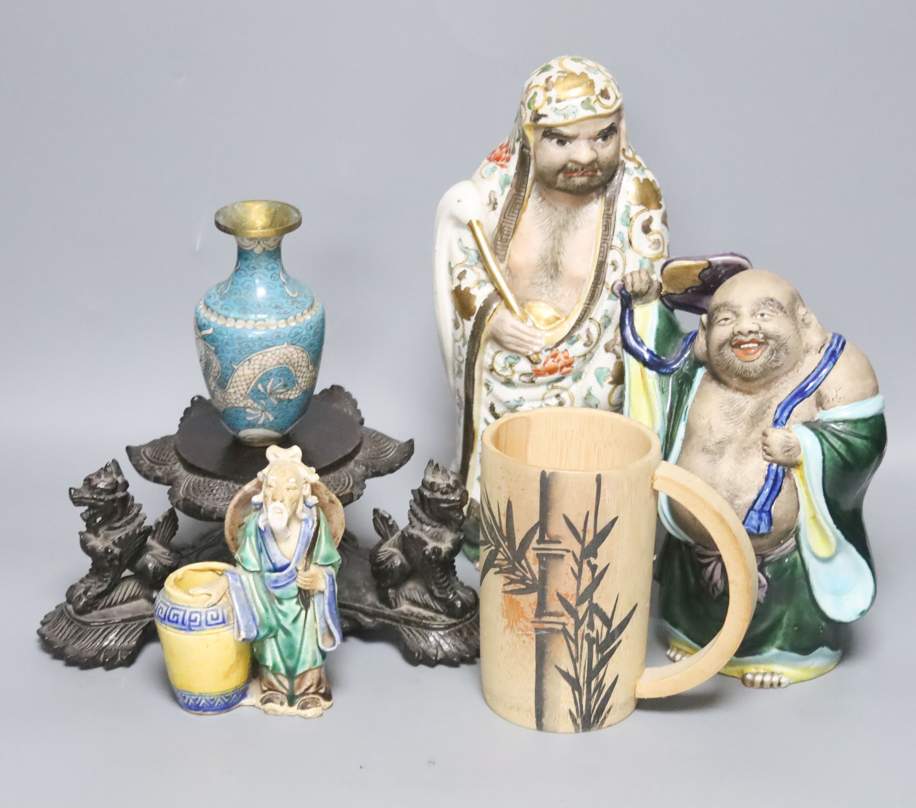 A group of Chinese and Japanese ceramics, a cloisonné enamel vase and a Burmese wood stand, tallest 27 cm